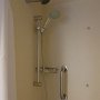 two shower heads, one fixed and one movable and can be placed lower