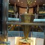 between the glass elevators, this beautiful tree receptical & Grand Staircase