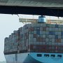 this container ship cannot go through the canal so it will stop load or unload at the loading dock we just passed.