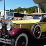 some beautiful old cars in front of the building